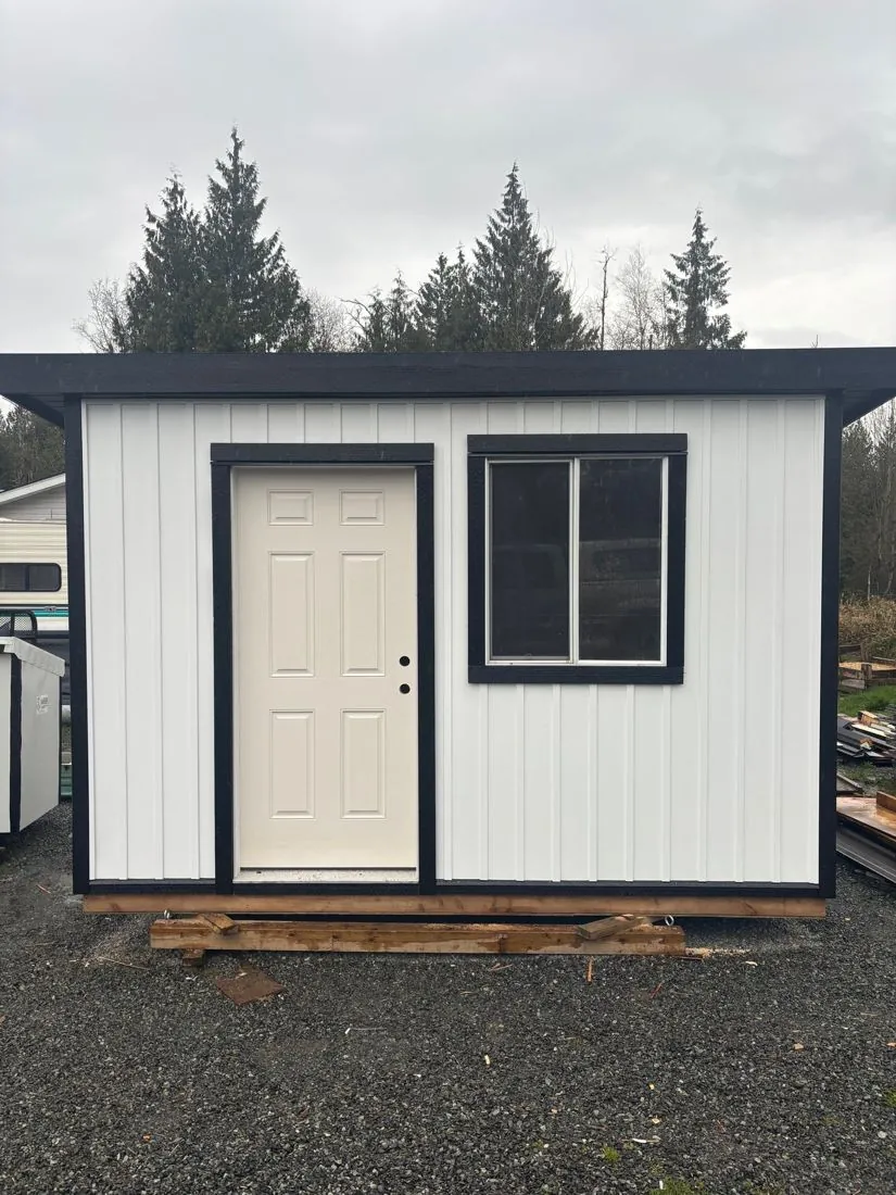 Finished white shed with black trim
